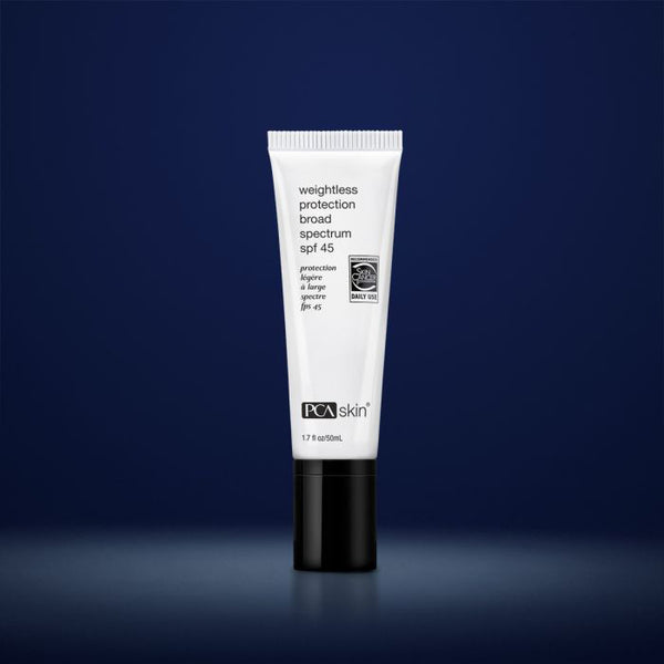 PCA Skin weightless protection broad spectrum SPF 45 tube on a dark blue background
