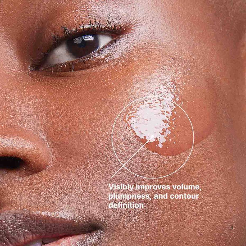 Close-up of a person's eye with a cosmetic product applied, labeled for skincare benefits.