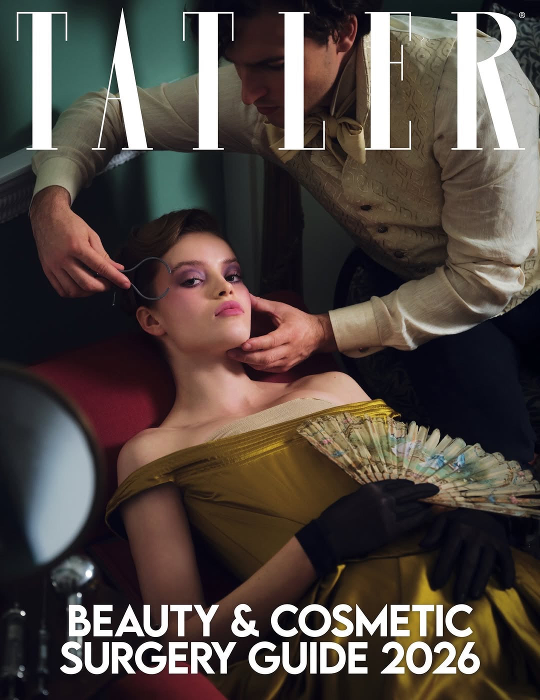 Cover of Tatler magazine featuring a woman in a yellow dress with a man adjusting her hair, titled 'Beauty & Cosmetic Surgery Guide 2026'.
