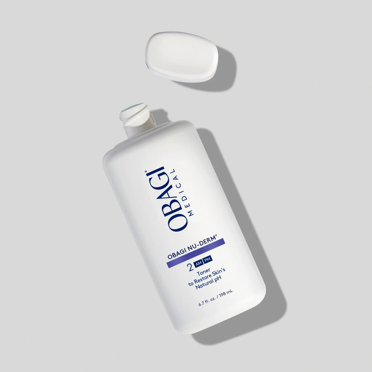 New Obagi Nu-Derm Toner packaging with updated clinical blue and white bottle design, professional skincare for pigmentation and ageing concerns.