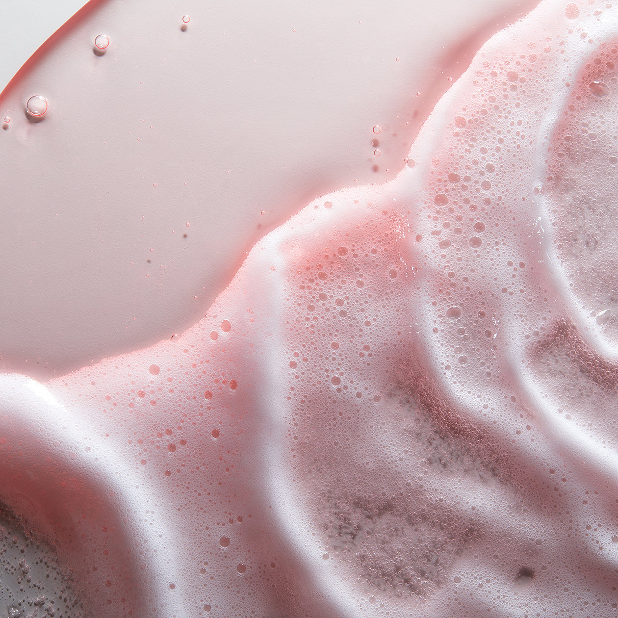 Close-up texture of Obagi Nu-Derm Foaming Gel lather, lightweight foam for deep cleansing and refreshed, balanced skin.
