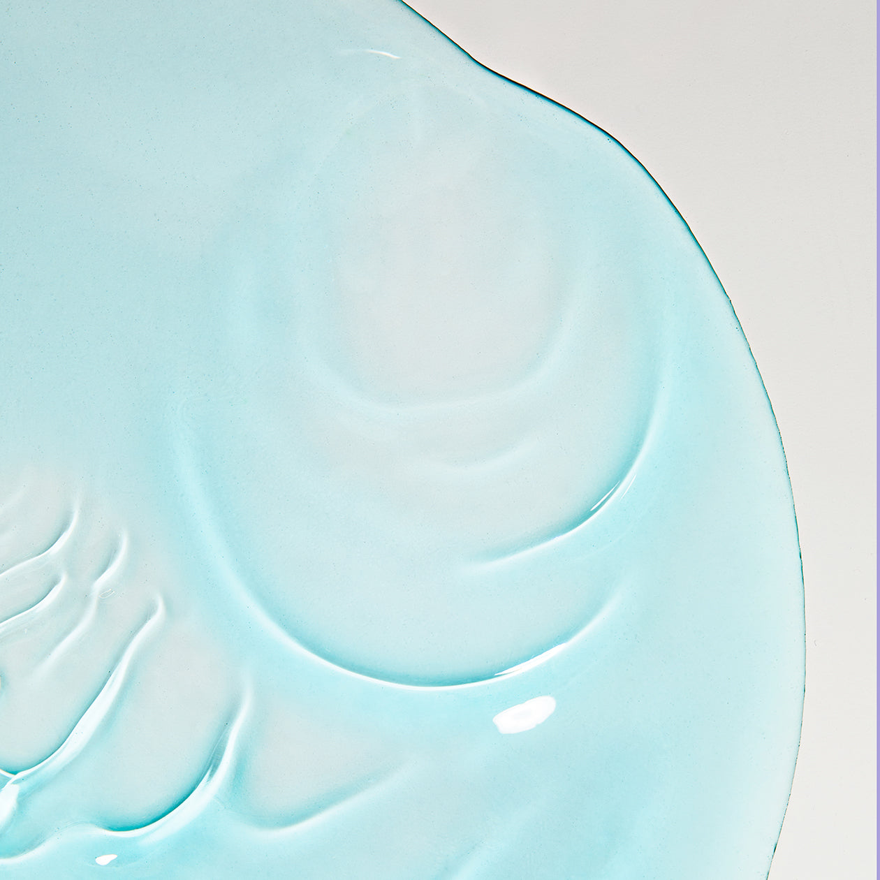 Close-up of Obagi Nu-Derm Toner clear liquid texture, refreshing alcohol-free formula to refine pores and enhance penetration of treatment serums.