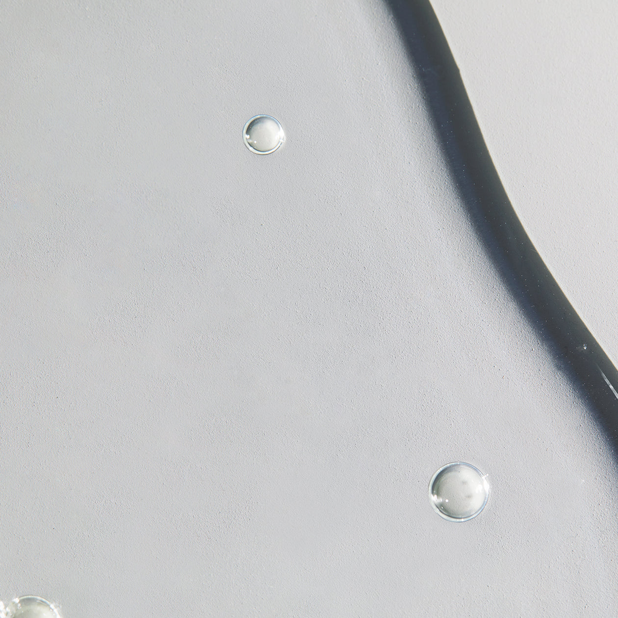 Close-up texture of Obagi Professional-C 10% Serum, lightweight formula for fast absorption and intense hydration.