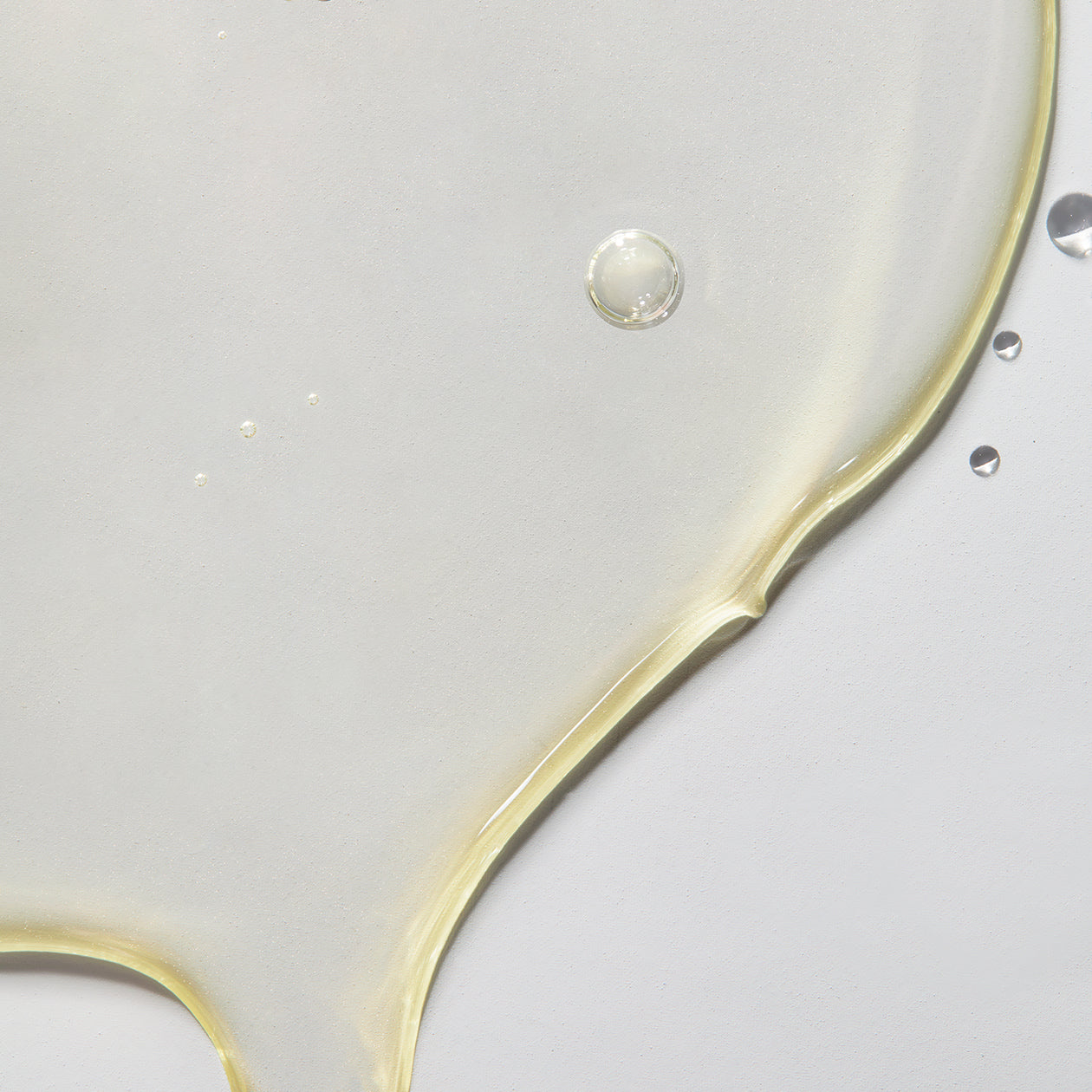 Close-up texture of Obagi Professional-C 15% Serum, lightweight formula for fast absorption and intense hydration.