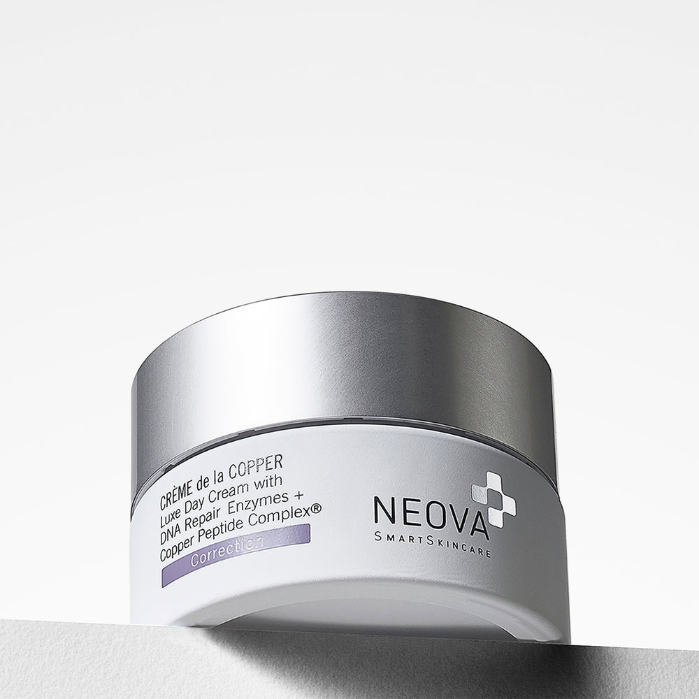 Neova Crème de la Copper moisturising cream jar on a light gray background, intensive hydration for dry and mature skin/.