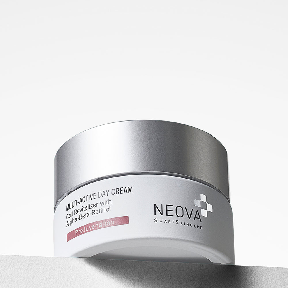 A silver cosmetic jar of NEOVA Multi-Active Day Cream with a white label, photographed on a clean white background. NEOVA Multi-Active Day Cream jar on a clean background, day moisturiser with retinol and hydroxy acids.