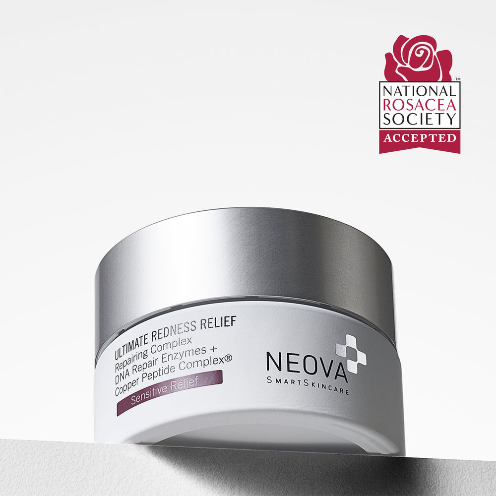 A silver cosmetic jar labeled 'Ultimate Redness Relief' by Neova Smartskincare, shown on a clean white background with a National Rosacea Society Accepted seal in the top right corner. NEOVA Ultimate Redness Relief cream on a clean background, soothing moisturiser for persistent or reactive redness.
