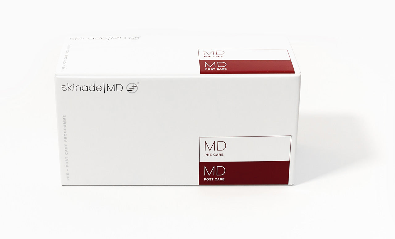 A white rectangular box of skinade|MD MD Pre-Care / MD Post-Care skincare packaging, featuring dark red accent blocks and black text, photographed on a clean white background. Skinade MD Pre + Post Care 45-day surgical support programme with sachets, capsules, and oral spray.