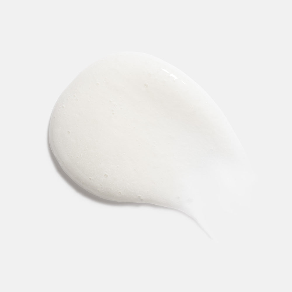Close-up of HydroPeptide Foaming Cream Cleanser texture, gentle exfoliating wash with rice powder and niacinamide.
