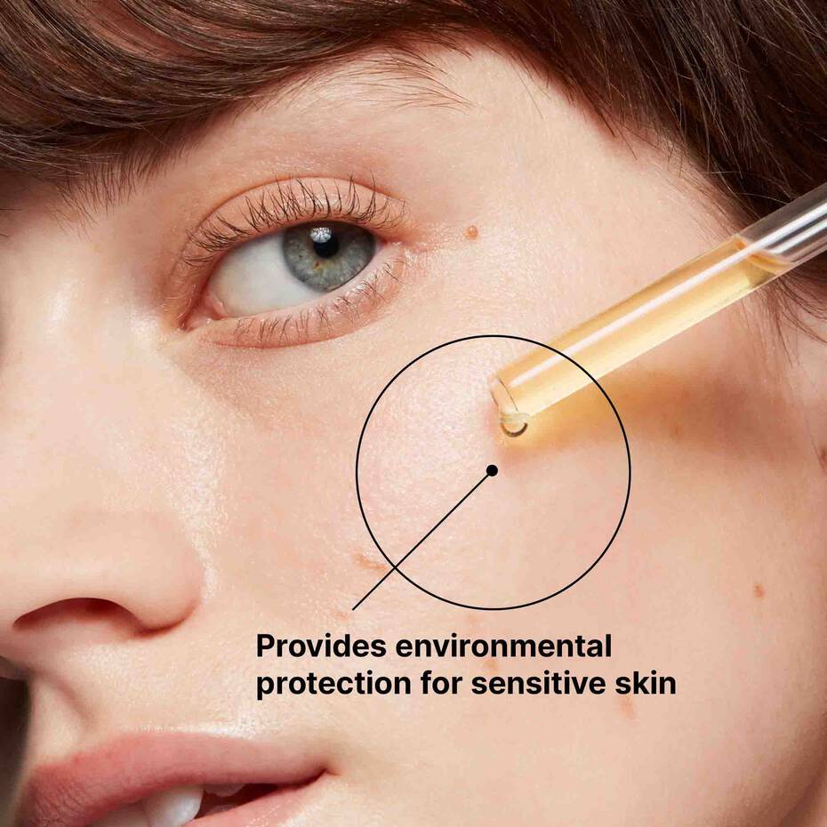 Model applying SkinCeuticals Serum 10—morning treatment for radiant complexion.