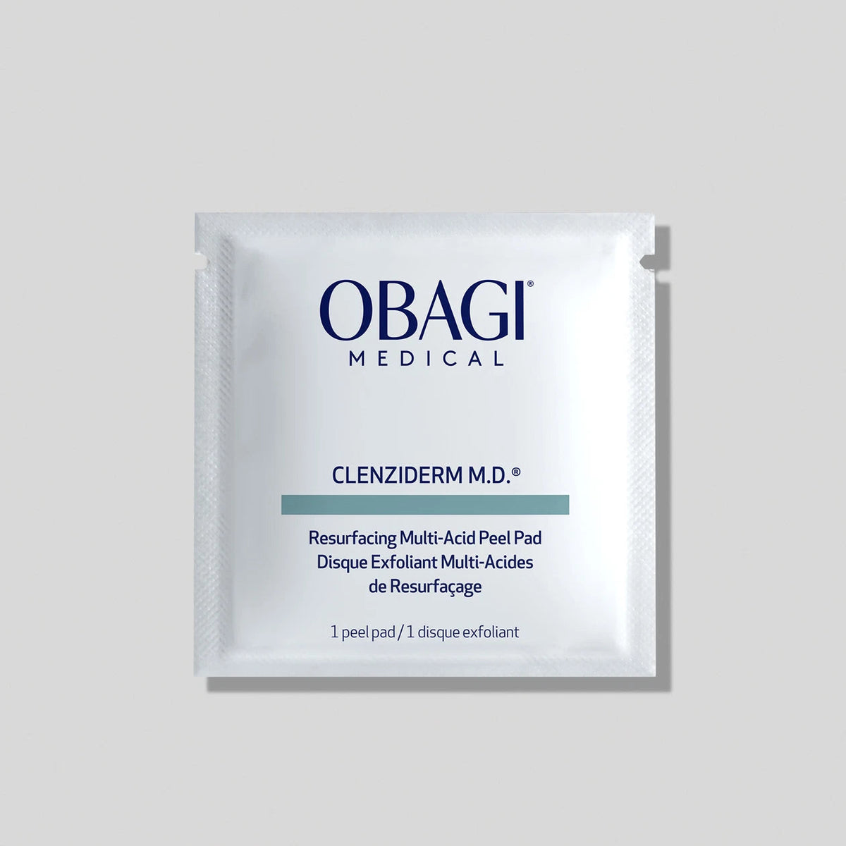 A single Obagi Medical Clenziderm M.D. resurfacing peel pad packet on a light gray background. Obagi CLENZIderm M.D. Resurfacing Multi-Acid Peel Pads for rough texture, dullness, visible pores, and discoloration.