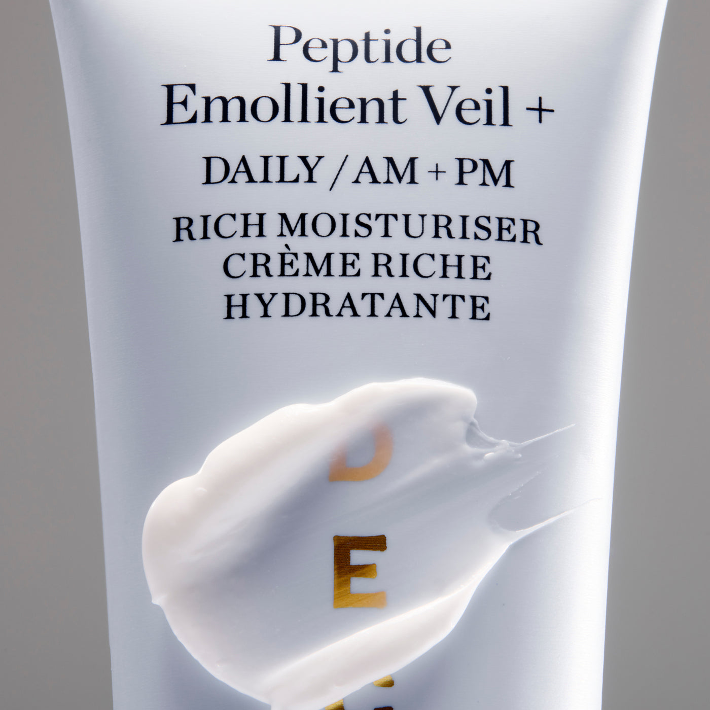 Skincare product packaging with 'Peptide Emollient Veil' text and cream illustration on a gray background