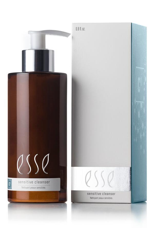 Brown bottle of esse sensitive cleanser with pump and white box on a white background. Esse Sensitive Cleanser gentle probiotic cream cleanser for sensitive and reactive skin.