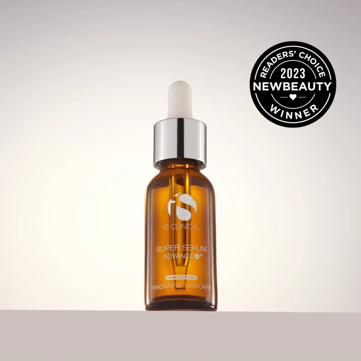 Brown serum bottle with dropper on a light gray background, featuring NewBeauty Readers' Choice 2023 award.